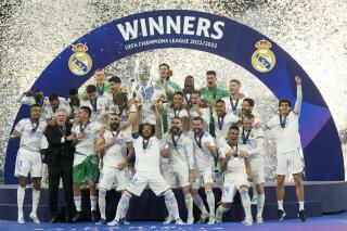 Amazon gets Champions League games in British TV deal AP News